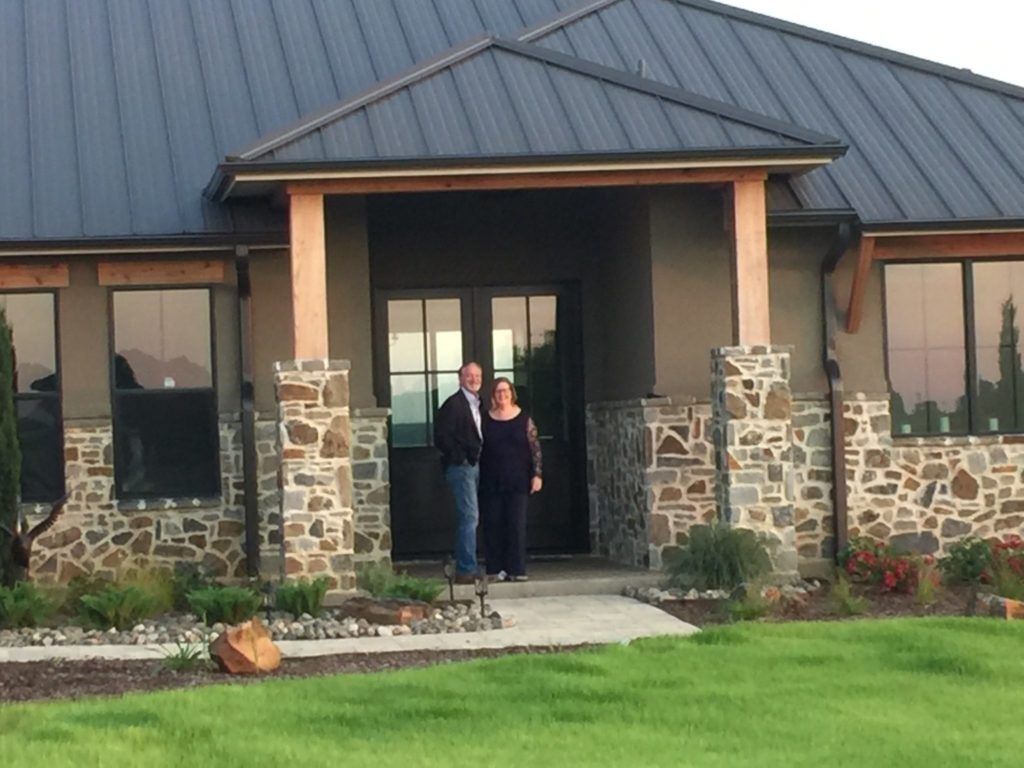 Full-time residents Mark and Jacque Meadows from McKinney, Texas pose at their new Beacon Hill home in Kemp, Tx.